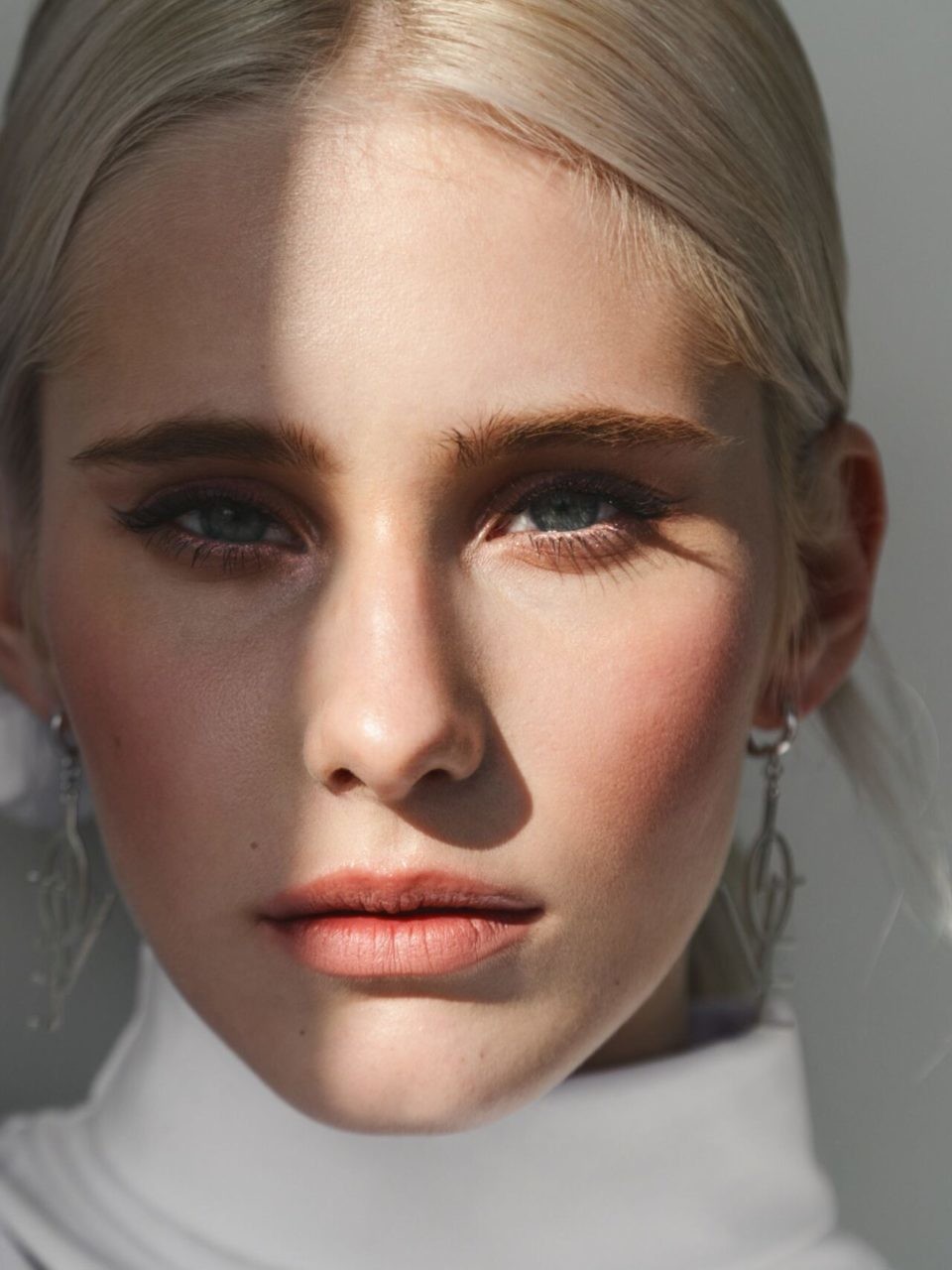 Fashion beauty portrait of young beautiful woman with shadow on